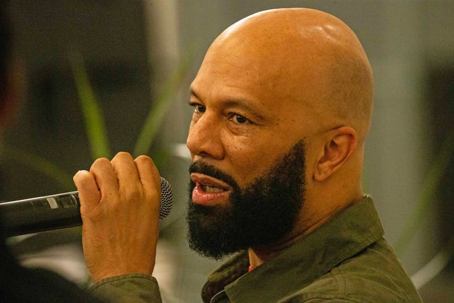 Common, rapper, actor, writer and activist, answers questions during a book talk and signing event for his book And Then We Rise: A Guide to Loving and Taking Care of Self at the Wilmington Public Library on Friday, Jan 26, 2024. A capacity crowd of approximately 350 people attended.