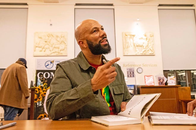 Common, rapper, actor, writer and activist, talks to a fan during the signing of his book And Then We Rise: A Guide to Loving and Taking Care of Self at the Wilmington Public Library on Friday, Jan 26, 2024. A capacity crowd of approximately 350 people attended.
