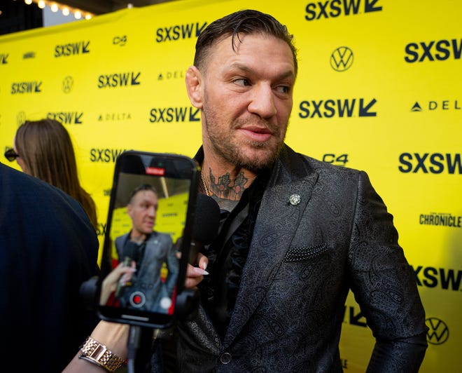 Conor McGregor speaks to press on the red carpet before the premiere of Road House at the Paramount Theatre in Austin, Texas on the first day of South by Southwest, Friday, March 8, 2024. McGregor plays the character "Knox" in the movie.