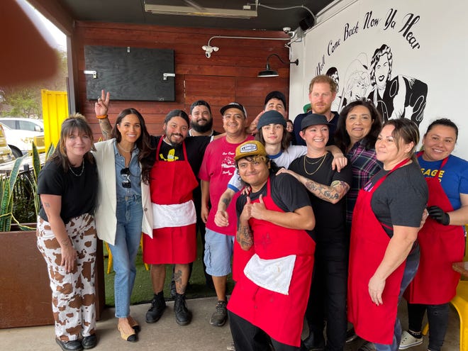 Prince Harry and Meghan Markle visited La Barbecue in Austin Friday and took photos with customers and employees before taking their barbecue order to go.