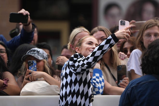 Emily Blunt takes photos with fans during "The Fall Guy" red carpet Tuesday, March 12, 2024, at the Paramount Theatre in downtown Austin.
