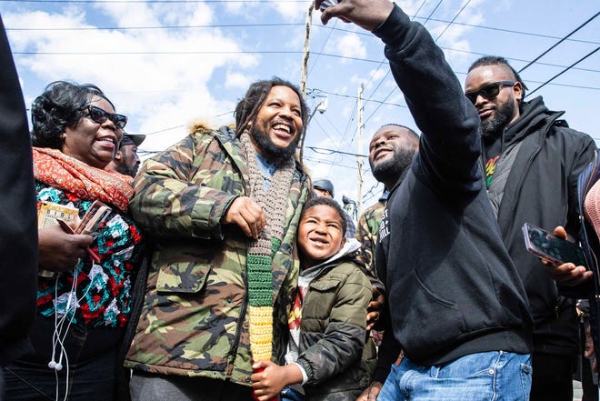 Community members take selfies with Stephen Marley, son of Bob and Rita Marley, at One Love Park/Tatnall Street Park in Wilmington, Wednesday, March 20, 2024. Marley, who was born in Wilmington and lived at the family's home on 24th Street, was presented with the key to the city by Mayor Purzycki.