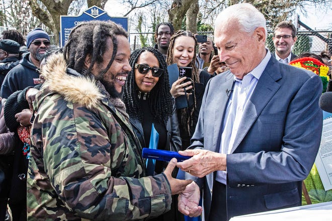 Stephen Marley, son of Bob and Rita Marley, accepts the key to the city from Mayor Purzycki at One Love Park/Tatnall Street Park in Wilmington, Wednesday, March 20, 2024. Marley, who was born in Wilmington and lived at the family's home on 24th Street.