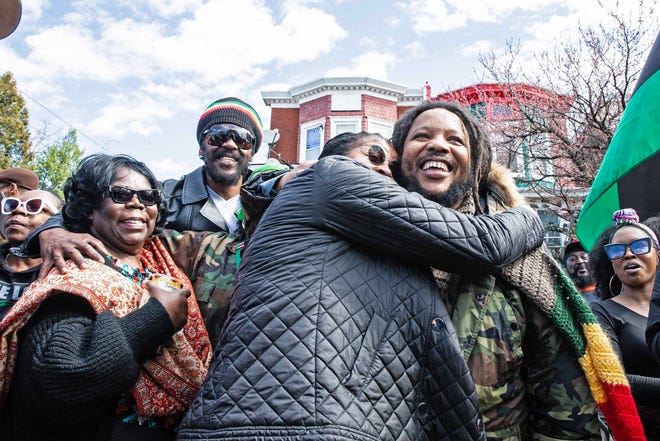 Malcolm family members take selfies with Stephen Marley, son of Bob and Rita Marley, at One Love Park/Tatnall Street Park in Wilmington, Wednesday, March 20, 2024. Marley, who was born in Wilmington and lived at the family's home on 24th Street, was presented with the key to the city by Mayor Purzycki.