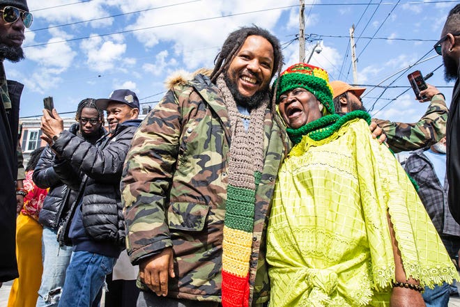 Malcolm family members take selfies with Stephen Marley, son of Bob and Rita Marley, at One Love Park/Tatnall Street Park in Wilmington, Wednesday, March 20, 2024. Marley, who was born in Wilmington and lived at the family's home on 24th Street, was presented with the key to the city by Mayor Purzycki.