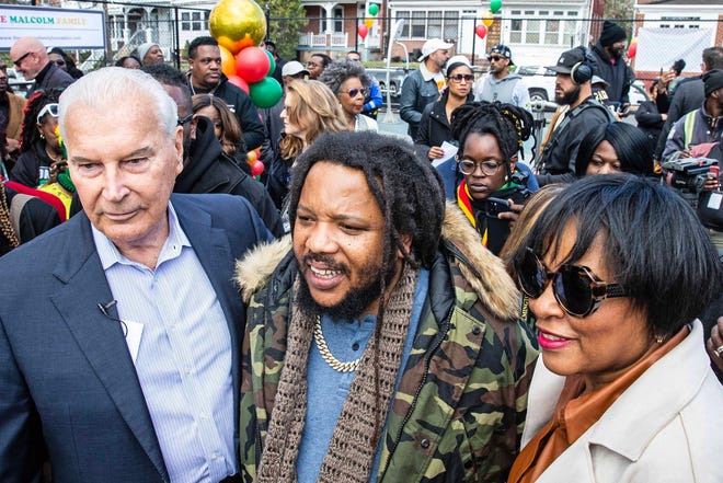 Community members witness Stephen Marley, son of Bob and Rita Marley, as he receives the key to the city from Mayor Purzycki at One Love Park/Tatnall Street Park in Wilmington, Wednesday, March 20, 2024. Marley was born in Wilmington and lived at the family's home on 24th Street.