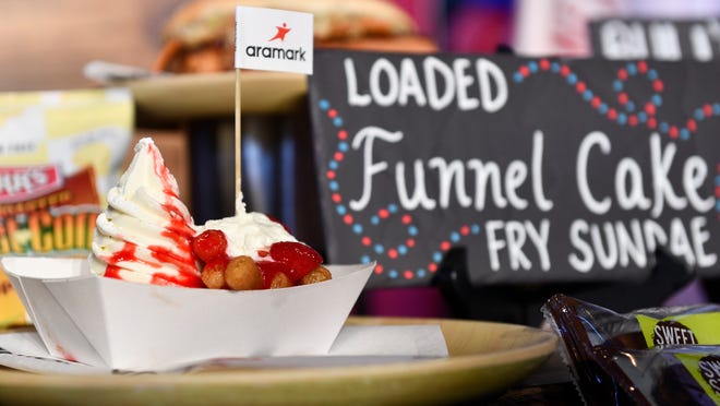 A loaded funnel cake fry sundae is displayed during an event to highlight what is new for the 2024 Philadelphia Phillies season at Citizens Bank Park in Philadelphia on Monday, March 25, 2024.