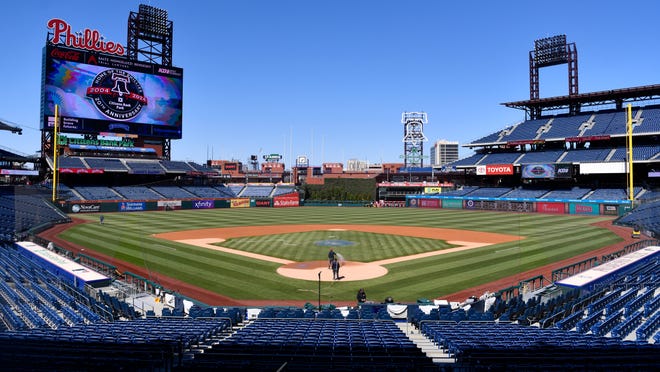 Members of the Phillies' grounds crew tend to the field at Citizens Bank Park in Philadelphia, in preparation of the start of the baseball season, on Monday, March 25, 2024.