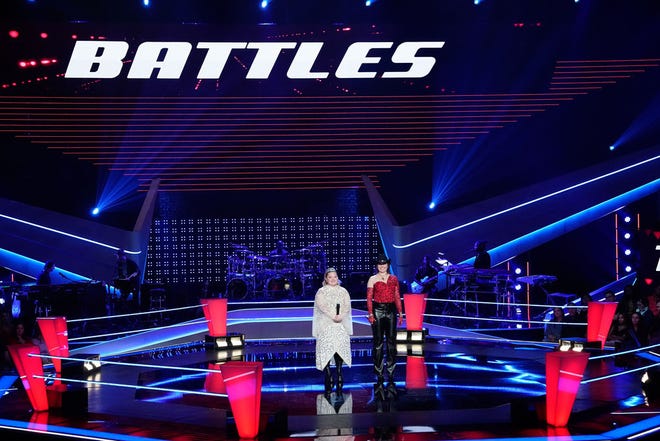 Hockessin singer Olivia Rubini (left) and fellow contestant Jackie Romeo await the decision of John Legend after performing Stevie Nicks' "Edge of Seventeen" in the "Battles" round of NBC's "The Voice" during the March 25 episode.