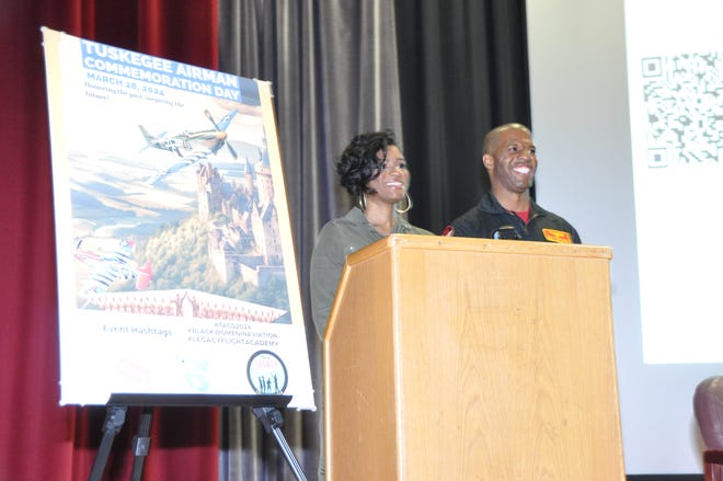 The organizers of the inaugural Tuskegee Airmen Commemoration Day in Dover, Samantha Mitchell, founder and president of Black Women in Aviation, and Legacy Flight Academy co-founder Lt. Col. Keny Ruffin, welcome students and guests to Dover Air Force Base March 28.