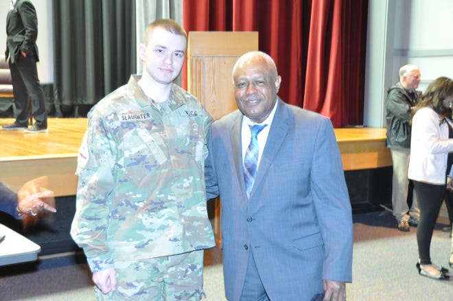 From left, Kaden Slaughter from the Virginia Tech Air Force ROTC meets Col. George London, an Air Force pilot who followed in the footsteps of the Tuskegee Airmen. London was the first test pilot on the C-17 Globemaster, one of the largest aircraft in the Air Force.