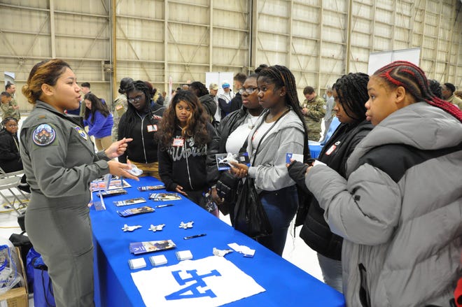 Lt. Isabella Mollison talks to students about opportunities in the U.S. Air Force Reserve Officers Training Corps during the inaugural Tuskegee Airmen Commemoration Day Expo March 28 at Dover Air Force Base.