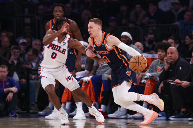 New York Knicks guard Donte DiVincenzo (0) dribbles against Philadelphia 76ers guard Tyrese Maxey (0) during the first quarter at Madison Square Garden.