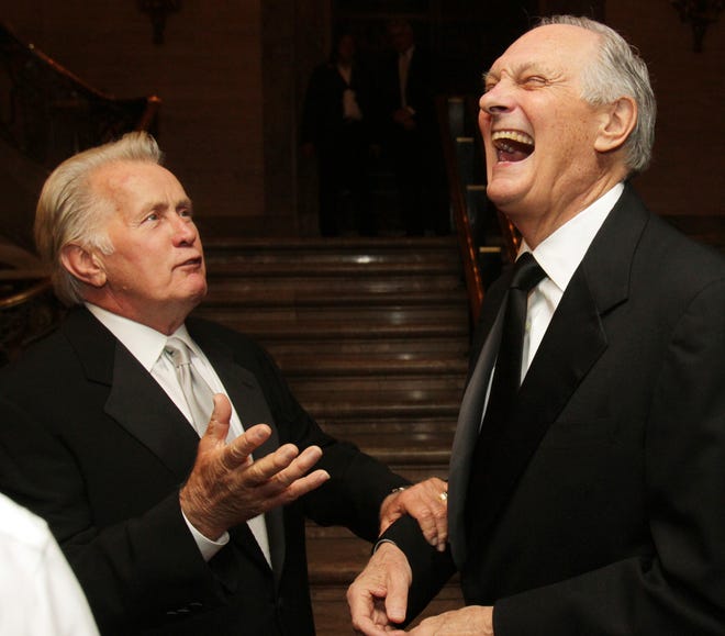 Martin Sheen (left) and Alan Alda joke at a reception for recipients of the Common Wealth Awards at the Hotel DuPont, Saturday, April 20, 2013.