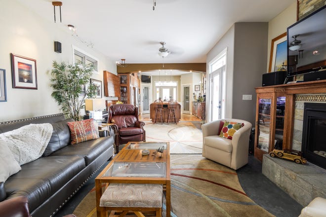 The living room at 1521 N. Adams St.  features heated concrete floors and a gas fireplace.