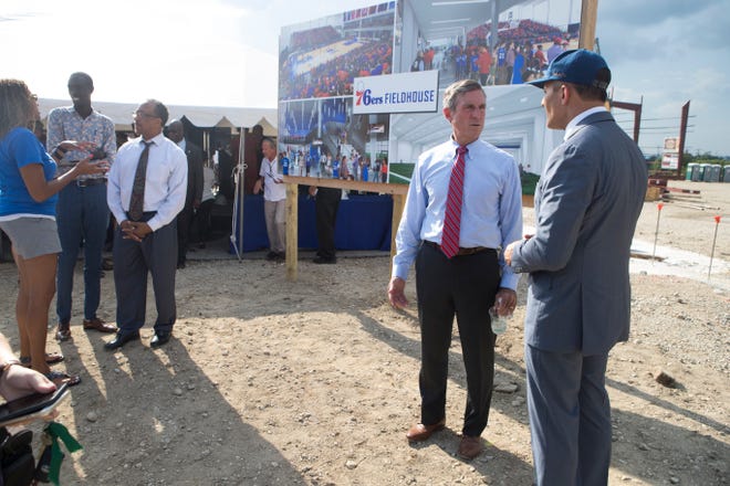 Delaware Governor John Carney, left, speaks with Robert Buccini during the groundbreaking celebration for the 76ers Fieldhouse Wednesday near the Riverfront. The sports complex will be the new home for the 76ers NBA G League team the Delaware Blue Coats.