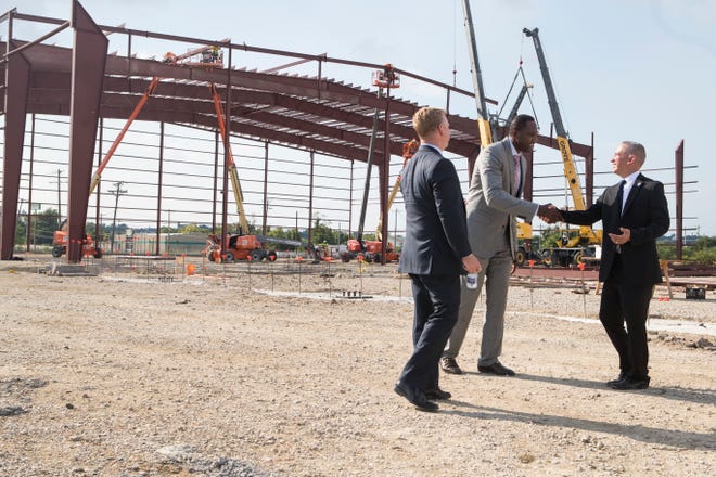 Philadelphia 76ers President of Business Operations Chris Heck, left, Delaware Blue Coats General Manager Elton Brand, center, and Delaware Blue Coats President Larry Meli meet in front of the future 76ers Fieldhouse after a groundbreaking celebration for the complex Wednesday in Wilmington.