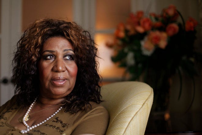 In this July 26, 2010 photo, performer Aretha Franklin looks out a window, in Philadelphia. Franklin says she believed Whitney Houston had overcome her demons and was primed for a comeback, which made learning of the troubled singer's death all the more of a shock. Interviewed on NBC's Today show Friday, Feb. 17, 2012, Franklin said she was watching TV in her hotel room in Charlotte, N.C., when she learned of Houston's death.