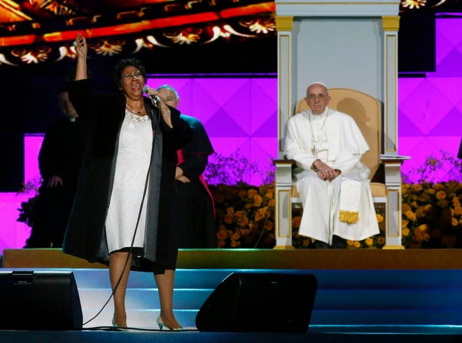 American singer Aretha Franklin sings as Pope Francis and others listen during the World Meeting of Families festival in Philadelphia, Saturday, Sept. 26, 2015.