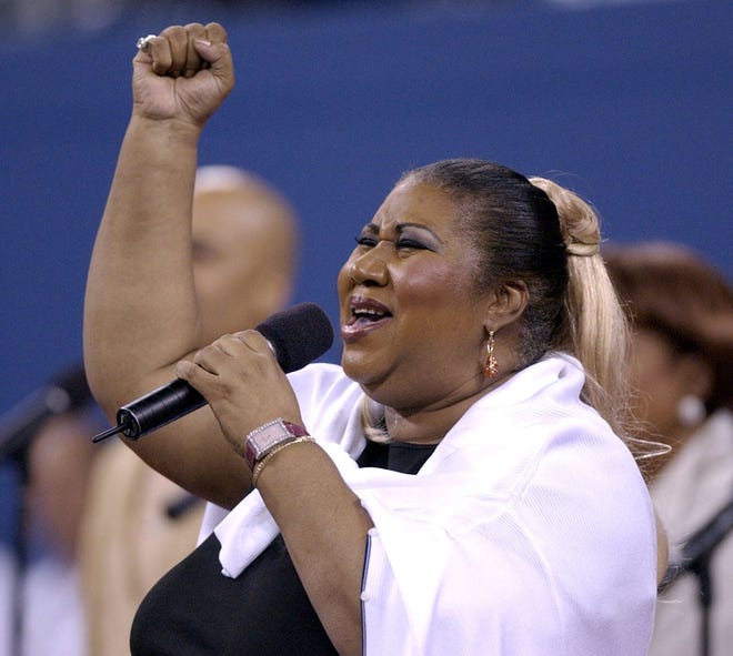 Aretha Franklin sings 'America the Beautiful' before the start of the womens' final between Venus Williams and Serena Williams at the US Open Saturday, Sept. 7, 2002 in New York.