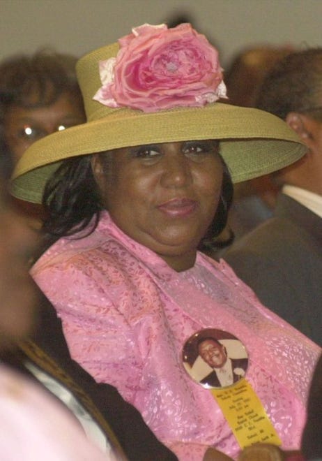 Singer Aretha Franklin wears a button with a picture of her father, the Rev. C.L. Franklin, during a gospel tribute to the clergyman Sunday, July 29, 2001, at New Bethel Baptist Church in Detroit. The Rev. Franklin was critically injured during a robbery attempt in 1979 and died in 1984 after lingering in a coma after being shot during the crime. The memorial, part of the Detroit 300 observance, featured musical tributes and testimonials from friends and colleagues.