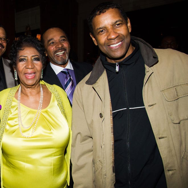 Aretha Franklin and Denzel Washington with Clifton Oliver, rear, attend her 72nd birthday celebration on Saturday, March 22, 2014 in New York.