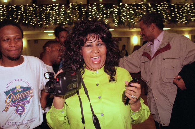 Aretha Franklin plays with a camcorder before a concert rehearsal in New York, April 27, 1995. Franklin's Thursday performance is to benefit New York City's Presbyterian Hospital's Sloane Hospital for Women. (AP Photo/Joe Tabacca)
