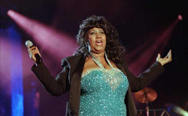 Soul singer Aretha Franklin finishes her set at the Concert for the Rock and Roll Hall of Fame in Cleveland, Saturday, Sep. 2, 1995. (AP Photo/Mark Duncan)