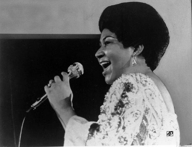 Vocalist Aretha Franklin warbles a few notes into microphone in Jan. 28, 1972 photo. (AP Photo)