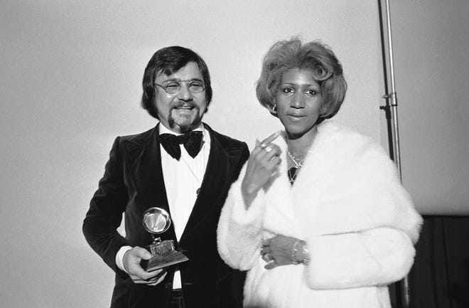 Sylvester Levay and Aretha Franklin,right, are shown at the Grammy Awards in Los Angeles, Feb. 28, 1976. (AP Photo)