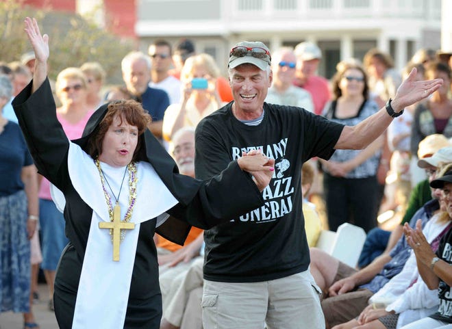 "Sister" Marie Wright dances with a member of the crowd at the Bethany Beach Jazz Funeral in 2011.