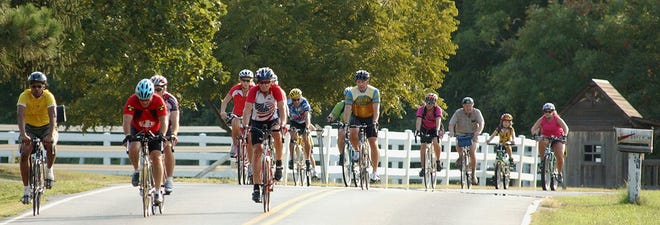 Bicyclists cruise the countryside west of Dover during a past Amish Bike Tour.