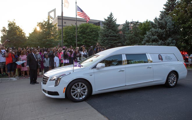 The funeral procession for Aretha Franklin departs Greater Grace Temple on Friday. Franklin, known as the Queen of Soul, died Aug. 16.