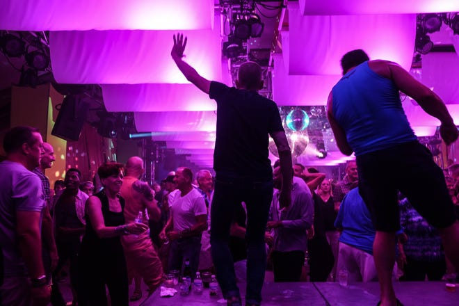 CAMP Rehoboth executive director Murray Archibald dances during Sundance, the nonprofit's 31st annual fundraiser, months after his husband and partner of almost 40 years, Steve Elkins, died of lymphoma. Sundance was one of Elkins' favorite events to plan and dance at.