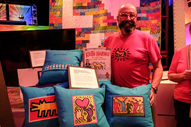 Timothy Credle had his pillows up for a live auction during Sundance, CAMP Rehoboth's 31st annual fundraiser. Credle also helped sew the fabric that later reflected the colors of the rainbow onto dancing bodies.