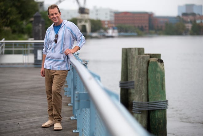 Tim Carr wears a striped hooded shirt from Brooklyn Cloth; blue T-shirt from Gap; tan draw-string khakis from Island Importer and tan hemp shoes from Sanuk.