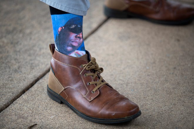 Tim Carr wears cotton Biggie Smalls socks from Zumiez with brown dress leather shoes from Sonoma and khaki pants.