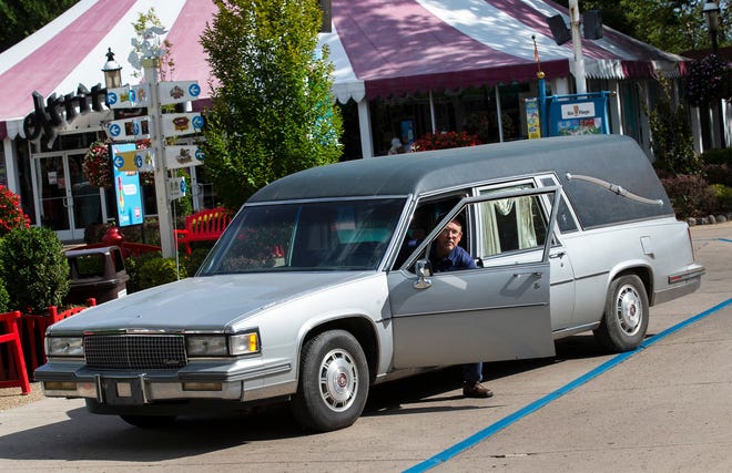 A old hearse is used in the Fright Night preparations to haul in backdrops of the Carnival area.