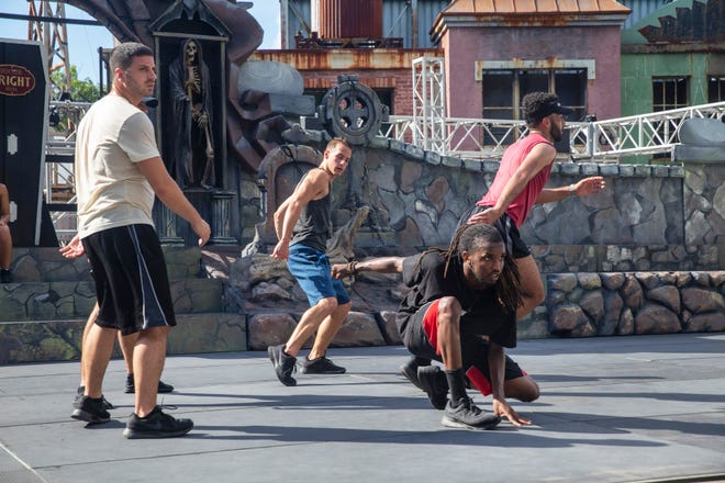 Dancers practice their moves as they prepare for the Dead Man’s Party show that is part of Fright Night at Six Flags Great Adventure.