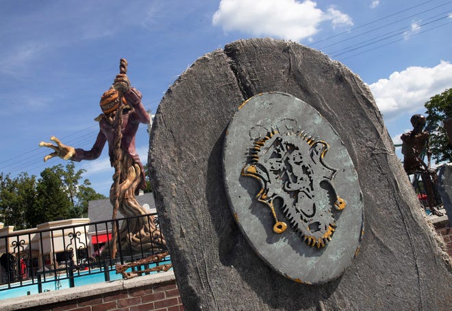 Gravestones and skeletons are added near the parkâ€™s center at the Bloody Fountain in preparation for Fright Fest.