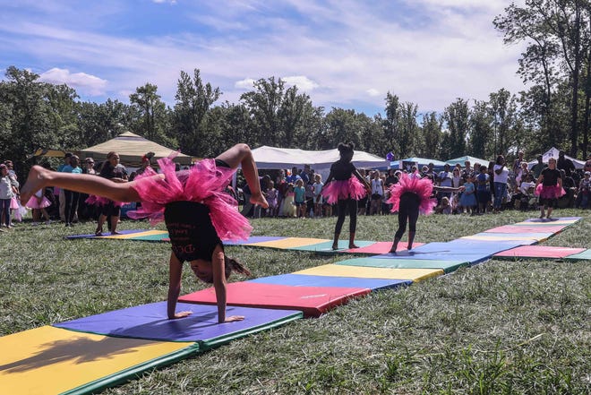 Guests watched tumblers at the annual Faerie Festival  Sunday, Sept. 16, 2018, Rockwood Park in Wilmington.