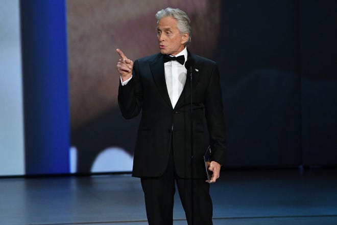 Michael Douglas presents the award for lead actor in a comedy series.