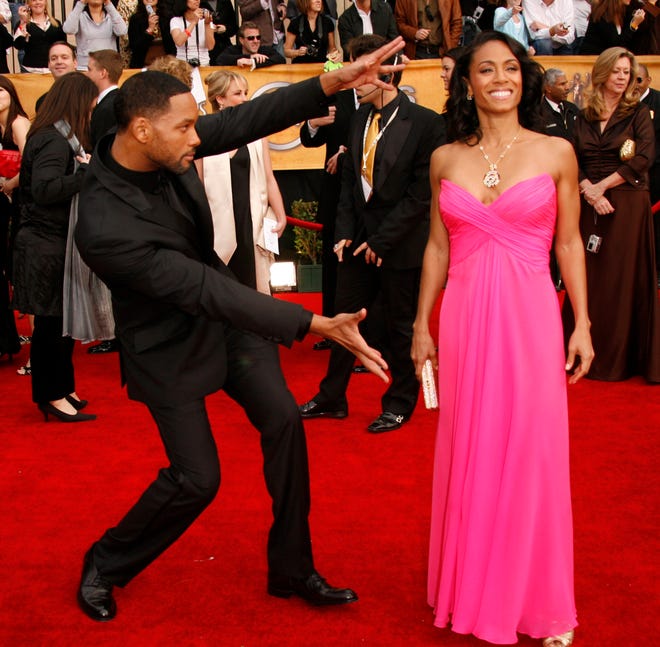 Will Smith and wife Jada Pinkett Smith pose for photographers at the 13th annual Screen Actors Guild Awards show at the Shrine Exposition Center in Los Angeles on Jan. 28, 2007.