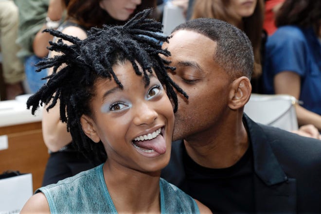 Will Smith and his daughter Willow Smith pose before Chanel 2016-2017 fall/winter Haute Couture collection fashion show on July 5, 2016, in Paris.