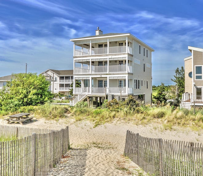 Decks on every level at 1416 S Bay Shore Drive at Broadkill Beach provide views of the water.