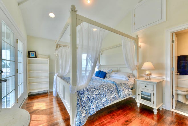 A spacious bedroom in 1416 S Bay Shore Drive at Broadkill Beach has views of Delaware Bay.