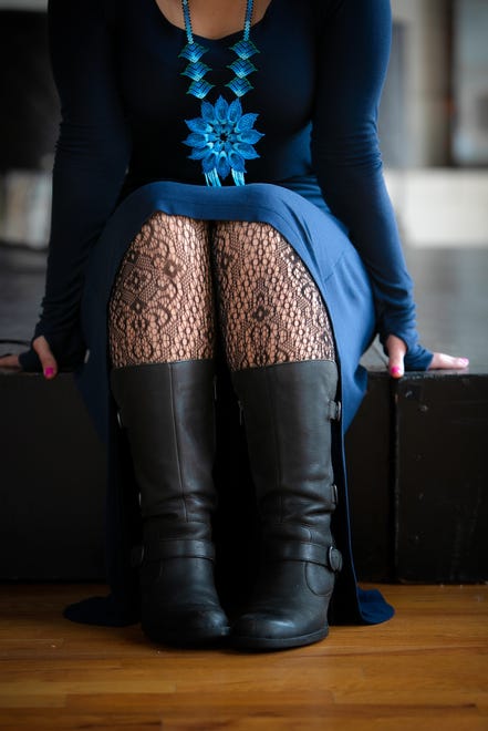 Sharin Macpherson wears a BCBG Max Azria navy blue high-low cotton dress; Leg Avenue tights from Trashy Diva; and Børn leather mid-calf boots.