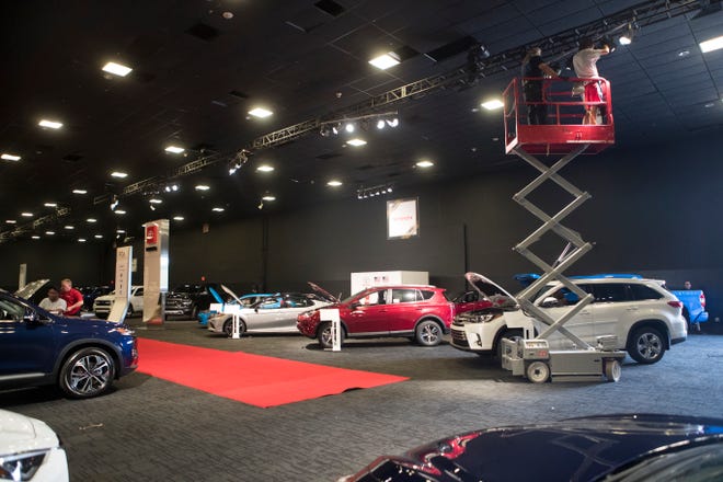 Crews prepare the finishing touches on the 2018 Delaware Auto Show at the Chase Center. The event runs Oct. 5-7.