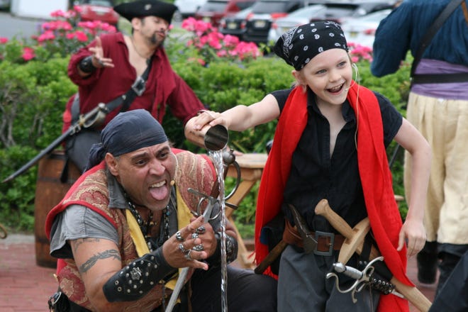 Cuthroat CorteZ and John "Little John" Morehouse of Pirates Plunder Entertainment Inc perform at the Belmar Pirate Walk  in June.