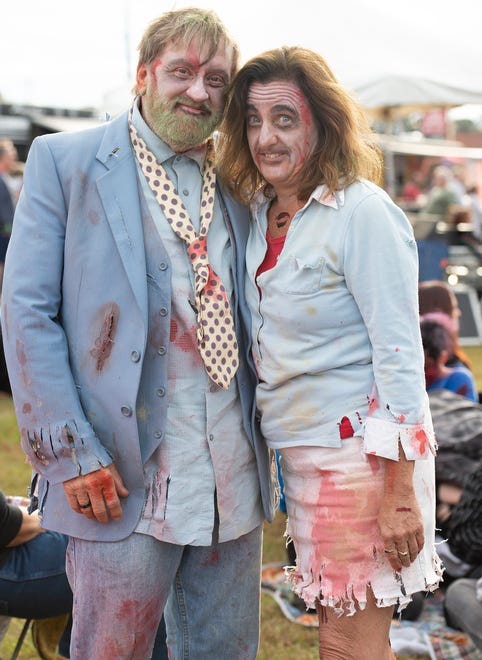 Kenny Johnson, left of Ocean City, Md., and Janet Murphy of Kennet Square, Pa., pose for a photo at Milton Zombie Fest.